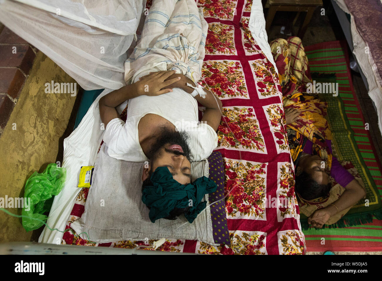 DHAKA, BANGLADESH - JULY 28 : Dengue fever patient receives treatment inside the 'Shaheed Suhrawardy' Medical Colleague Hospital in Dhaka , Bangladesh Stock Photo
