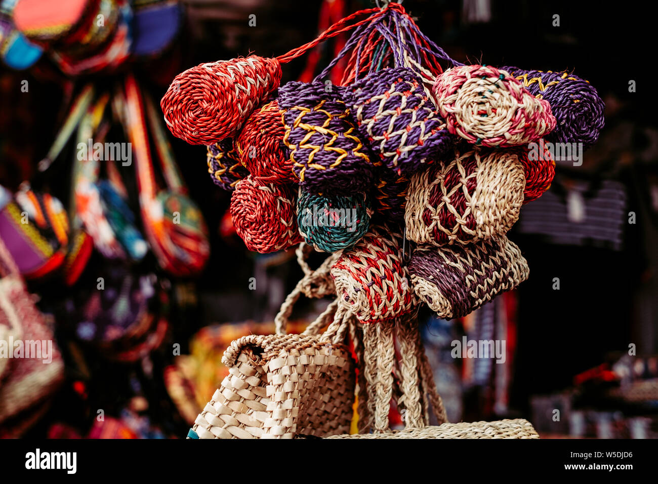 Bunch of handmade purses made from natural Abaca plant. Animal free. Selective focus Stock Photo