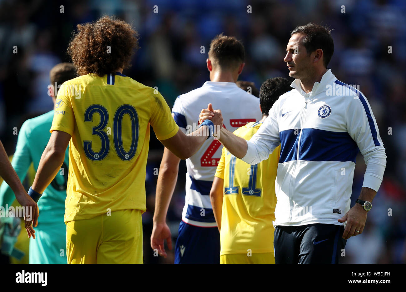 Chelsea's David Luiz shakes hand with manager Frank Lampard after the final whistle during the pre-season friendly match at the Madejski Stadium, Reading. Stock Photo