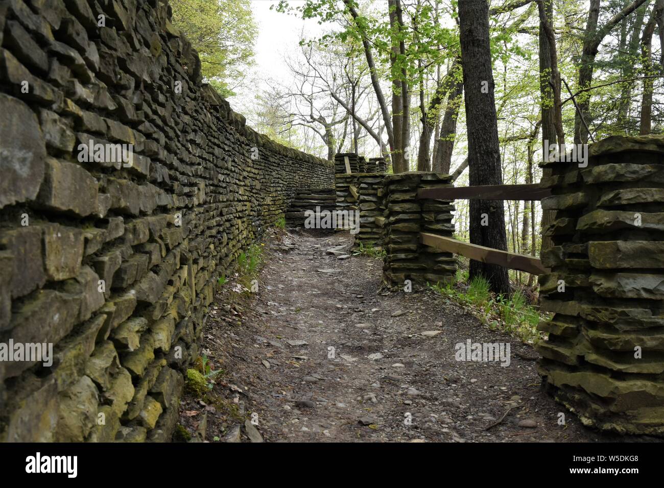A hiking trail in Letchworth State Park Lined by rouged stone barriers