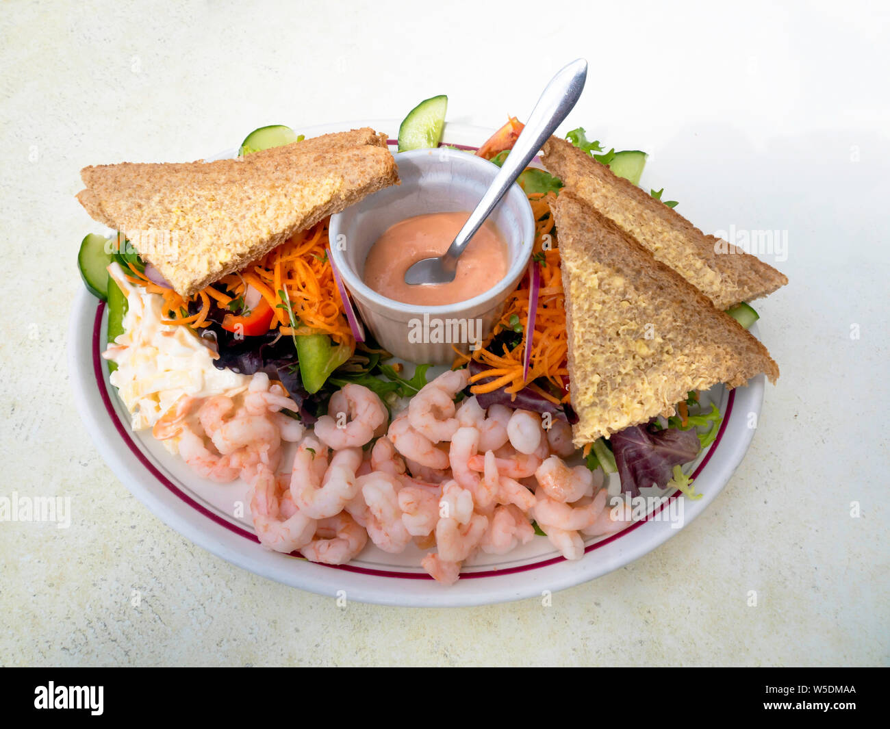 Light lunch meal Prawn  salad with Rose Marie Sauce and sliced brown bread Stock Photo