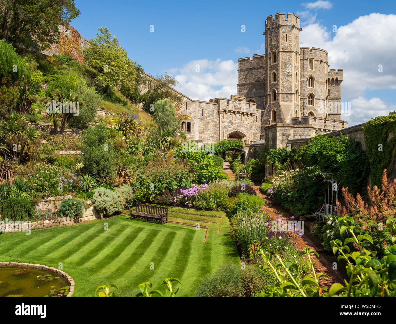 A private lawned area in the moat at the royal Windsor Castle in England on a hot summers day Stock Photo