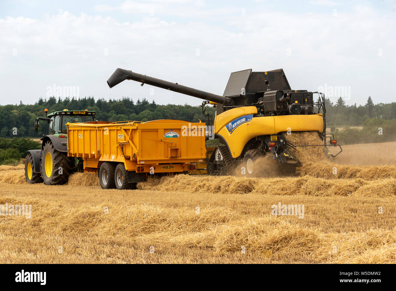 Combine harvester offloading grain hires stock photography and images