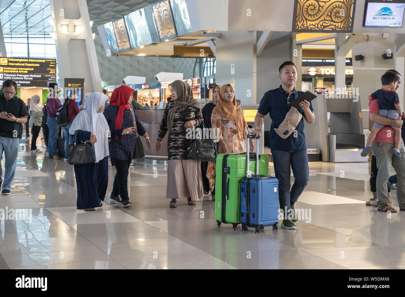 Jakarta, Indonesia - April 2019: Indonesian passengers in Soekarno