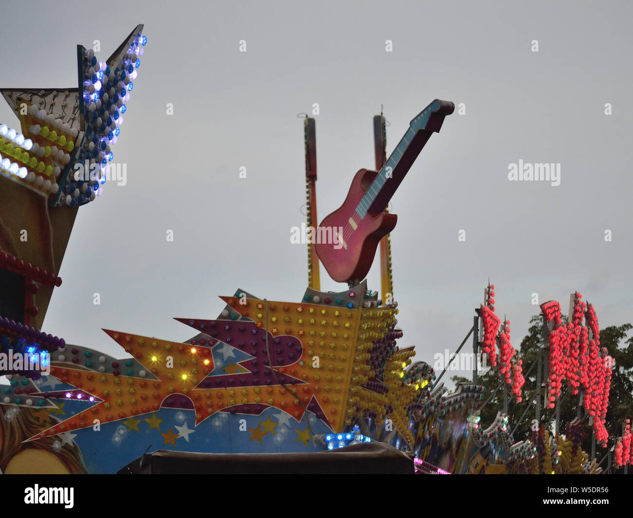 Guitar sign on amusement park ride, Svilajnac, Serbia, Europe Stock Photo