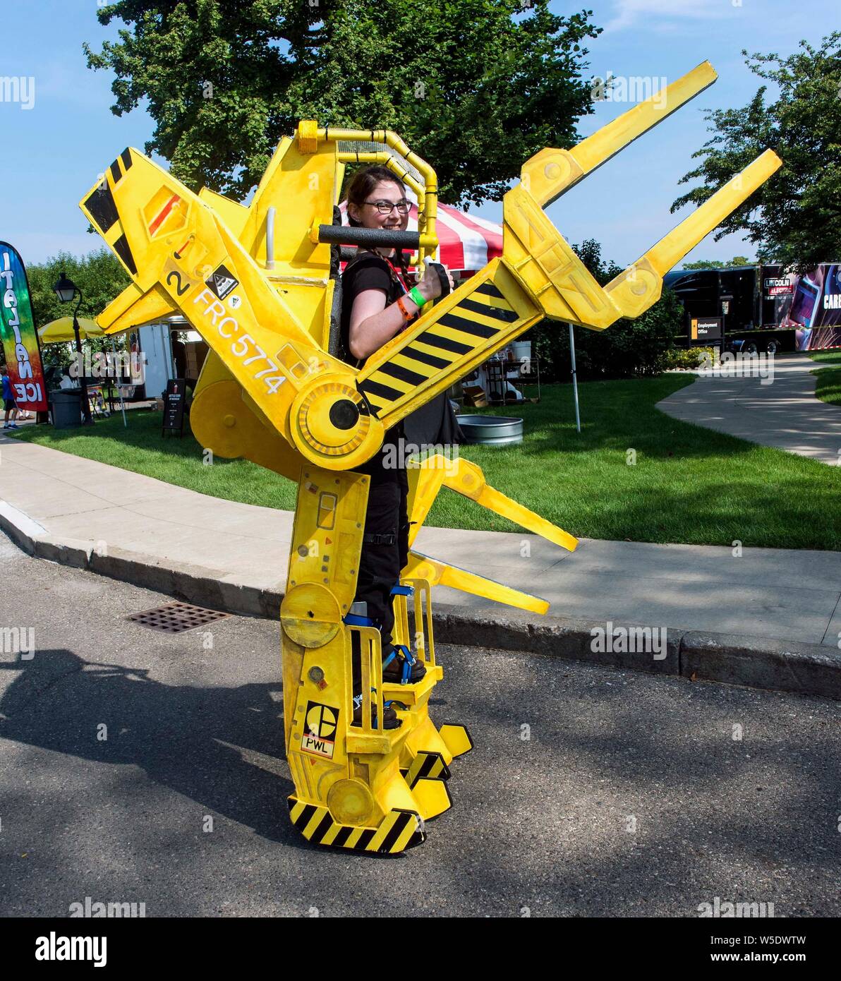 Dearborn, Michigan, USA. 28th July, 2019. A power loader from the film, 'Alien, ' walks the midway during the 10th Annual Maker Faire Detroit at the Henry Ford Museum of American Innovation. Maker Faire is a gathering of tech enthusiasts, tinkerers, engineers and science club members who gather to show and share knowledge about what they've made. Credit: Brian Cahn/ZUMA Wire/Alamy Live News Stock Photo
