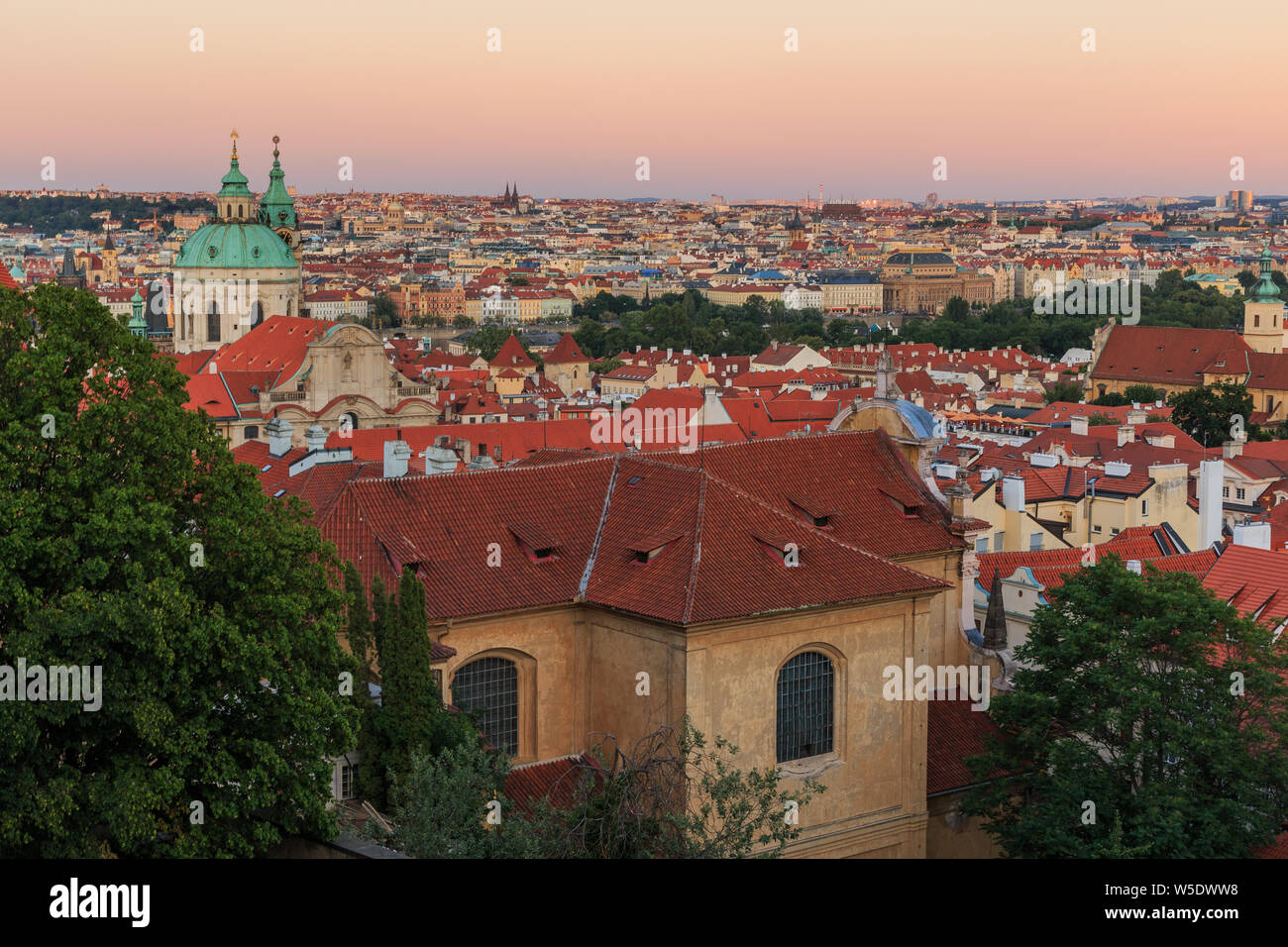 Cityscape over the roofs of the Old Town Prague View from the district Lesser Town with stairs from the Prague Castle with alley, historical buildings Stock Photo