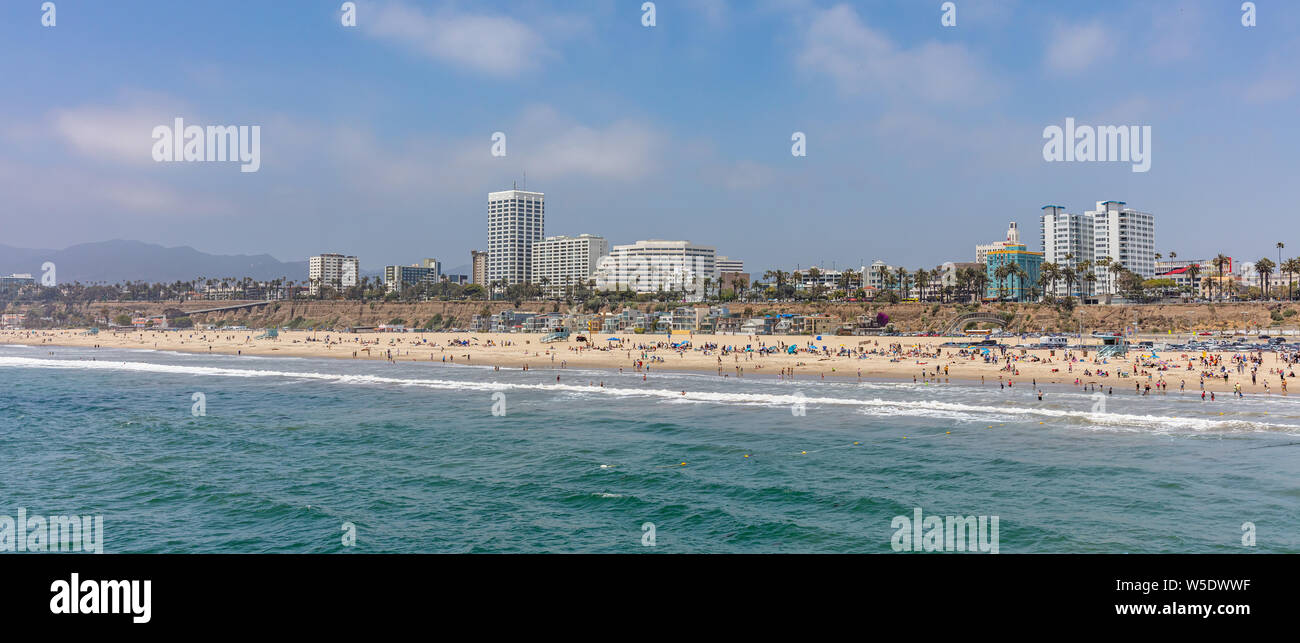 California USA. May 30, 2019. Santa Monica beach panoramic view, People on sandy beach. Pacific ocean coastline Los Angeles. Blue sky and sea Stock Photo