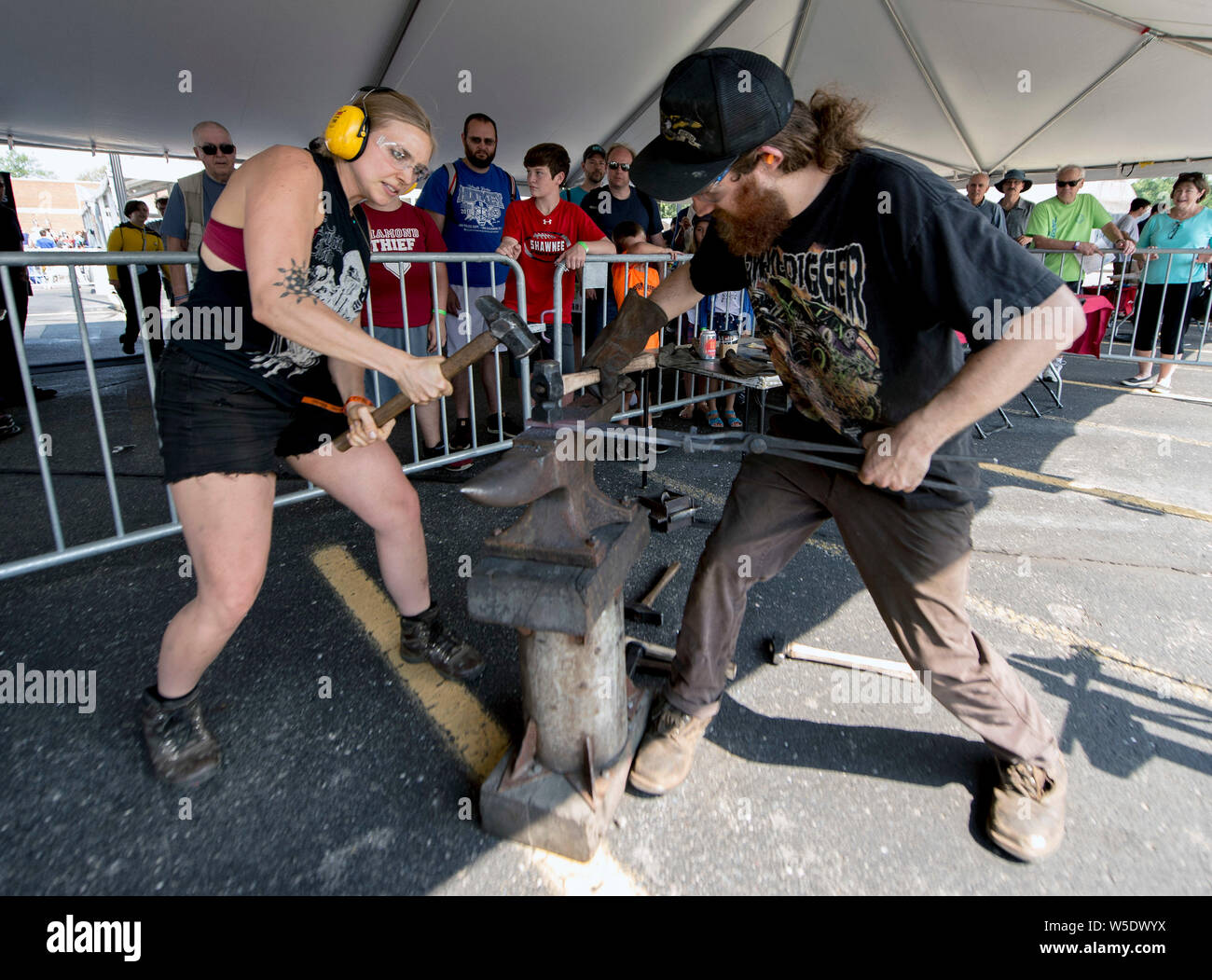Dearborn, Michigan, USA. 28th July, 2019. MEGAN GRIERSON and AARON DESHIELDS demonstrate blacksmithing during the 10th Annual Maker Faire Detroit at the Henry Ford Museum of American Innovation. Maker Faire is a gathering of tech enthusiasts, tinkerers, engineers and science club members who gather to show and share knowledge about what they've made. Credit: Brian Cahn/ZUMA Wire/Alamy Live News Stock Photo