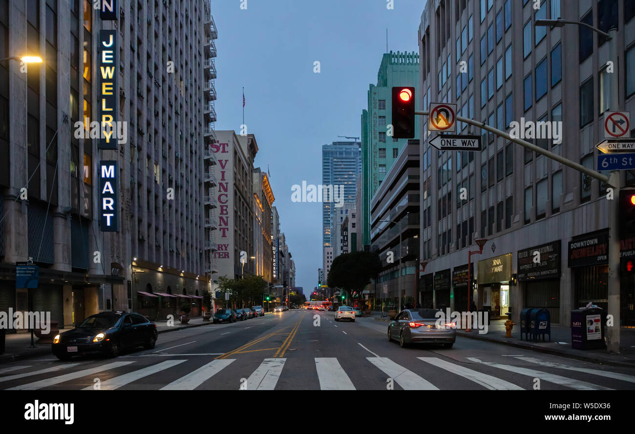 Los Angeles California USA. June 1st, 2019. Skyscrapers illuminated, car lights on the street, blue sky background, spring evening Stock Photo