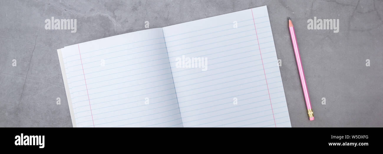 Flat lay, top view, notebook, pencil on a gray textured background Stock Photo