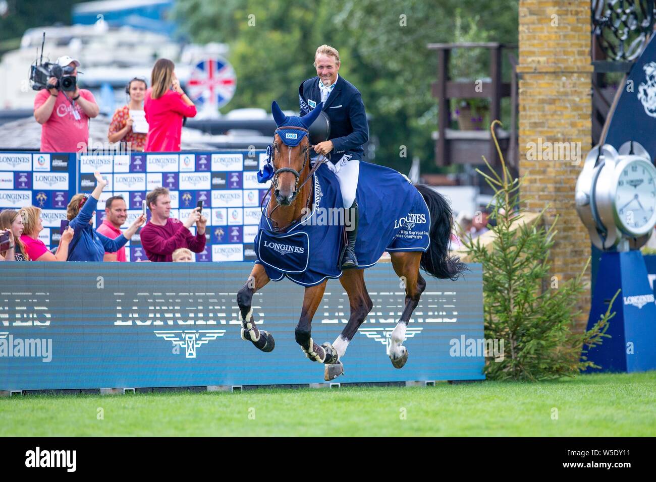 Hickstead, West Sussex, UK. 28th July 2019.  Winner David Will (GER) riding Never Walk Alone. The Longines BHS King George V Gold Cup at the Royal International Horse Show. Credit: Sport In Pictures/Alamy Live News Stock Photo
