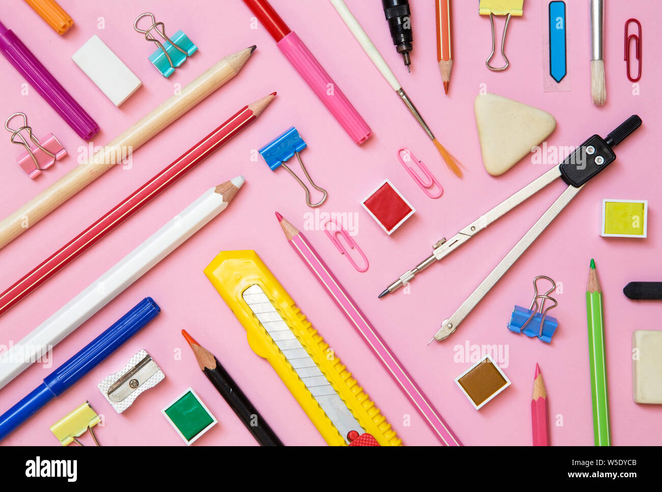School supplies on pink paper background top view Stock Photo Alamy