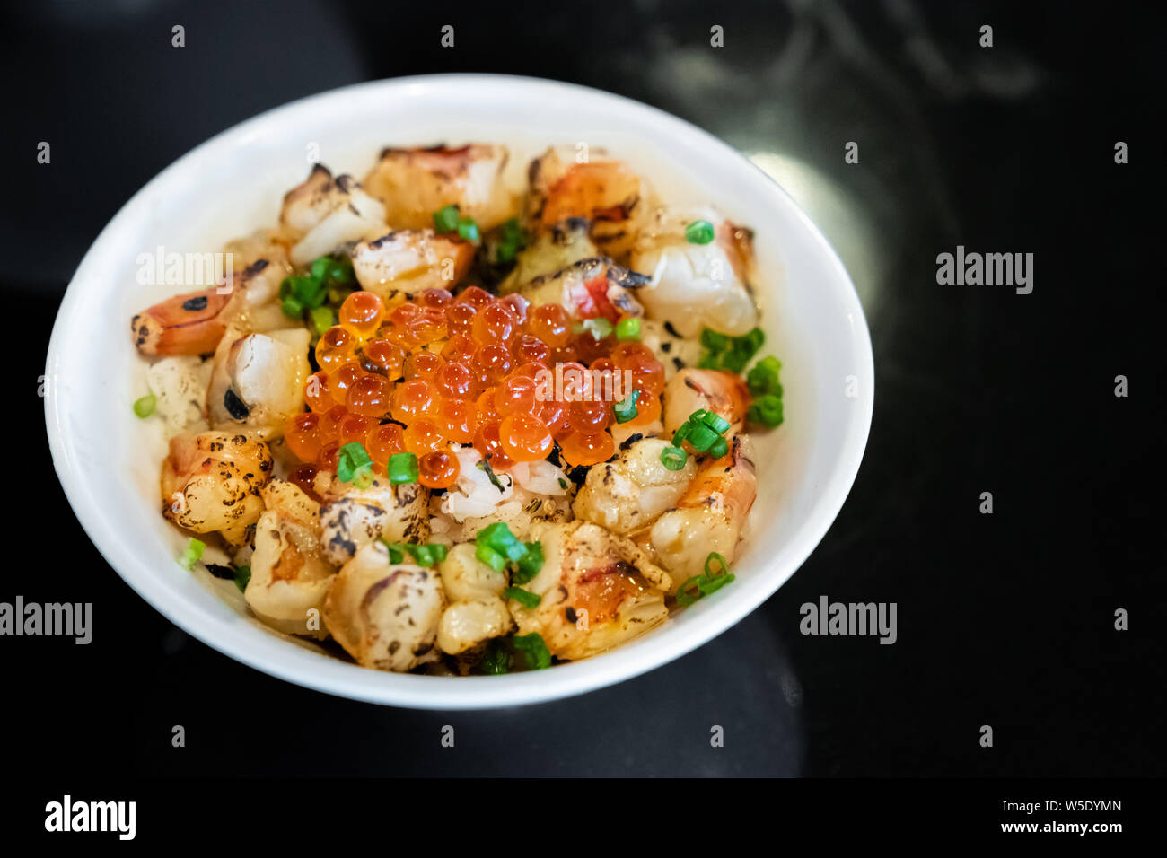 grilled prawn shrimp ebidon Donburi with salmon roe and egg Stock Photo