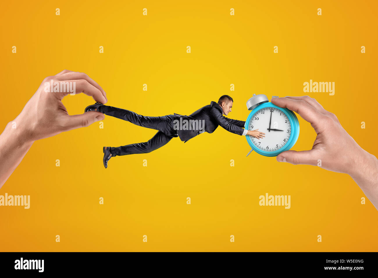 Small businessman being pulled in opposite directions by two big hands