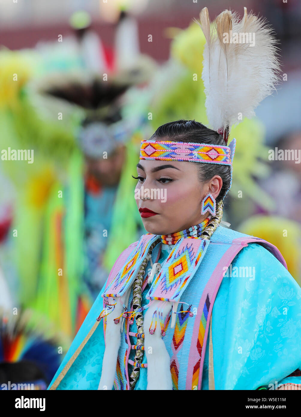 Dancers perform during the Grand Entry of the Julyamsh Pow Wow in Coeur