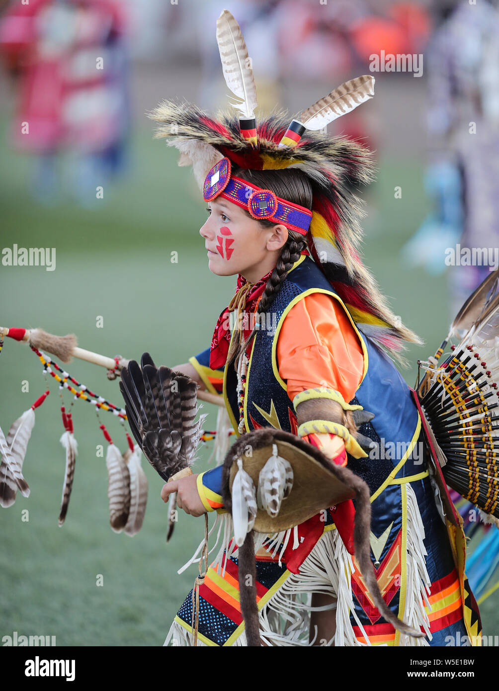 Dancers perform during the Grand Entry of the Julyamsh Pow Wow in Coeur
