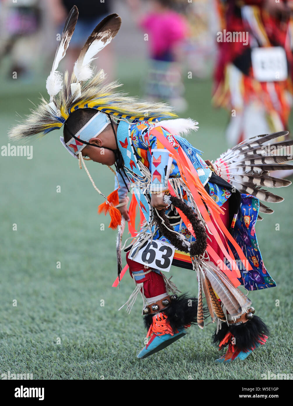 Dancers perform during the Grand Entry of the Julyamsh Pow Wow in Coeur