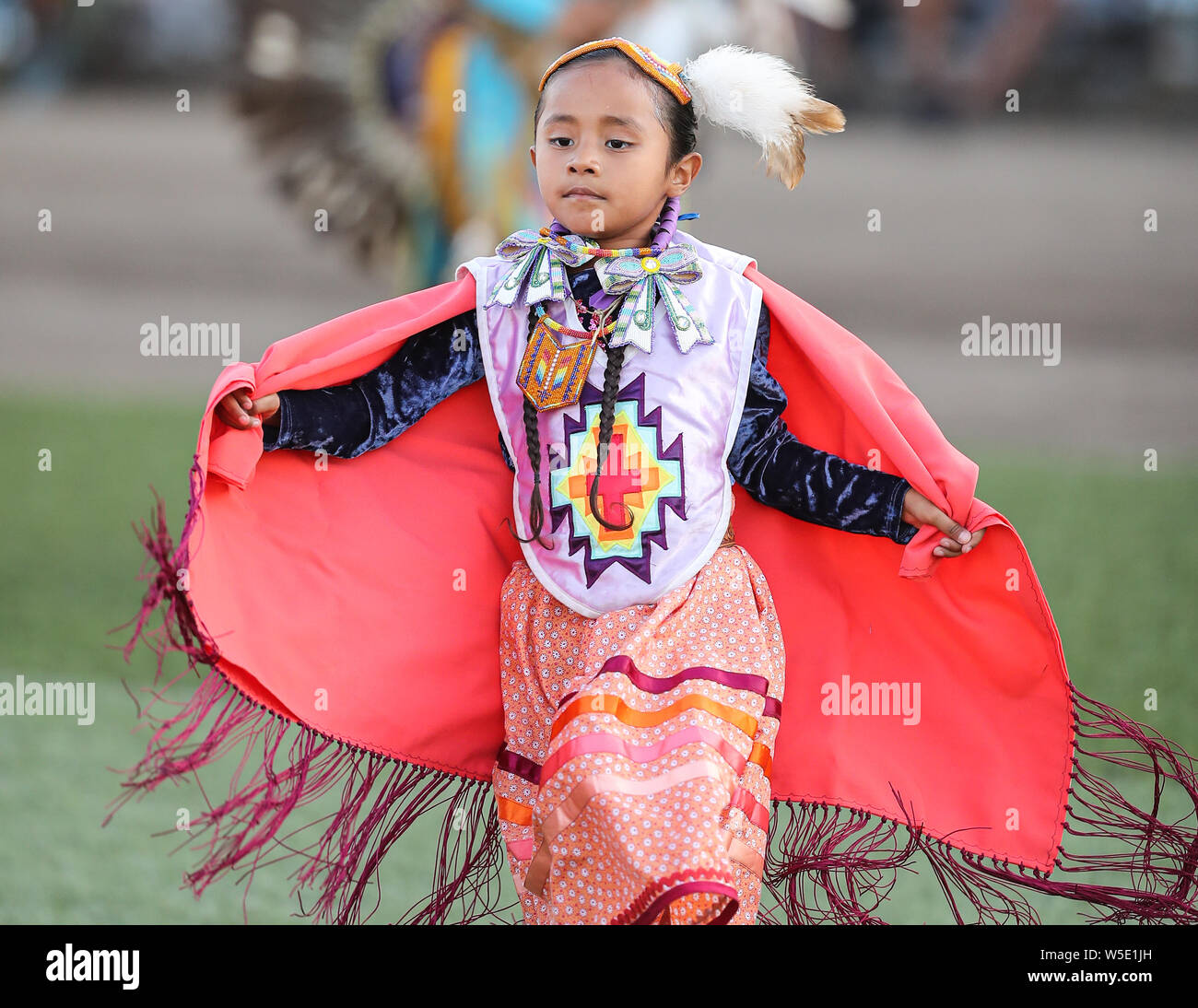 Dancers perform during the Grand Entry of the Julyamsh Pow Wow in Coeur