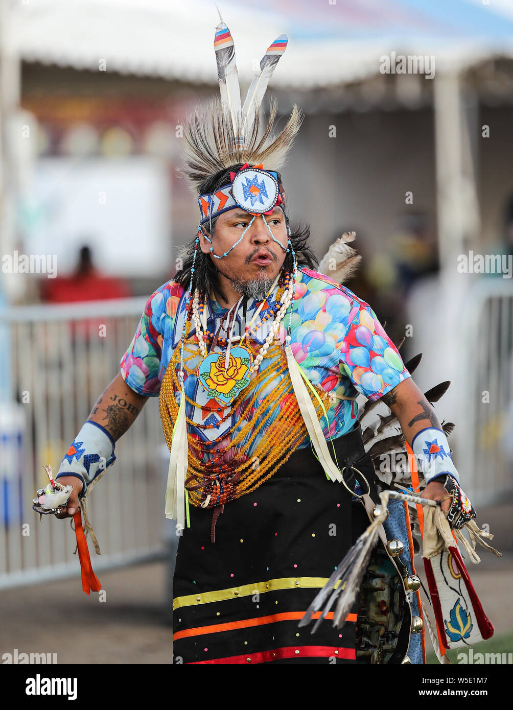 Dancers perform during the Grand Entry of the Julyamsh Pow Wow in Coeur