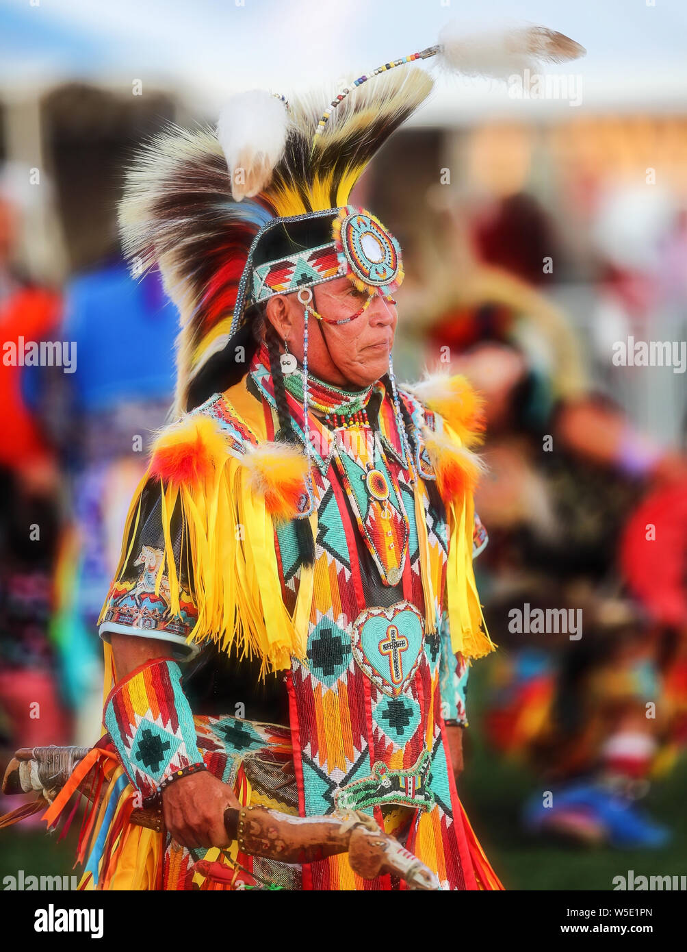 Dancers perform during the Grand Entry of the Julyamsh Pow Wow in Coeur