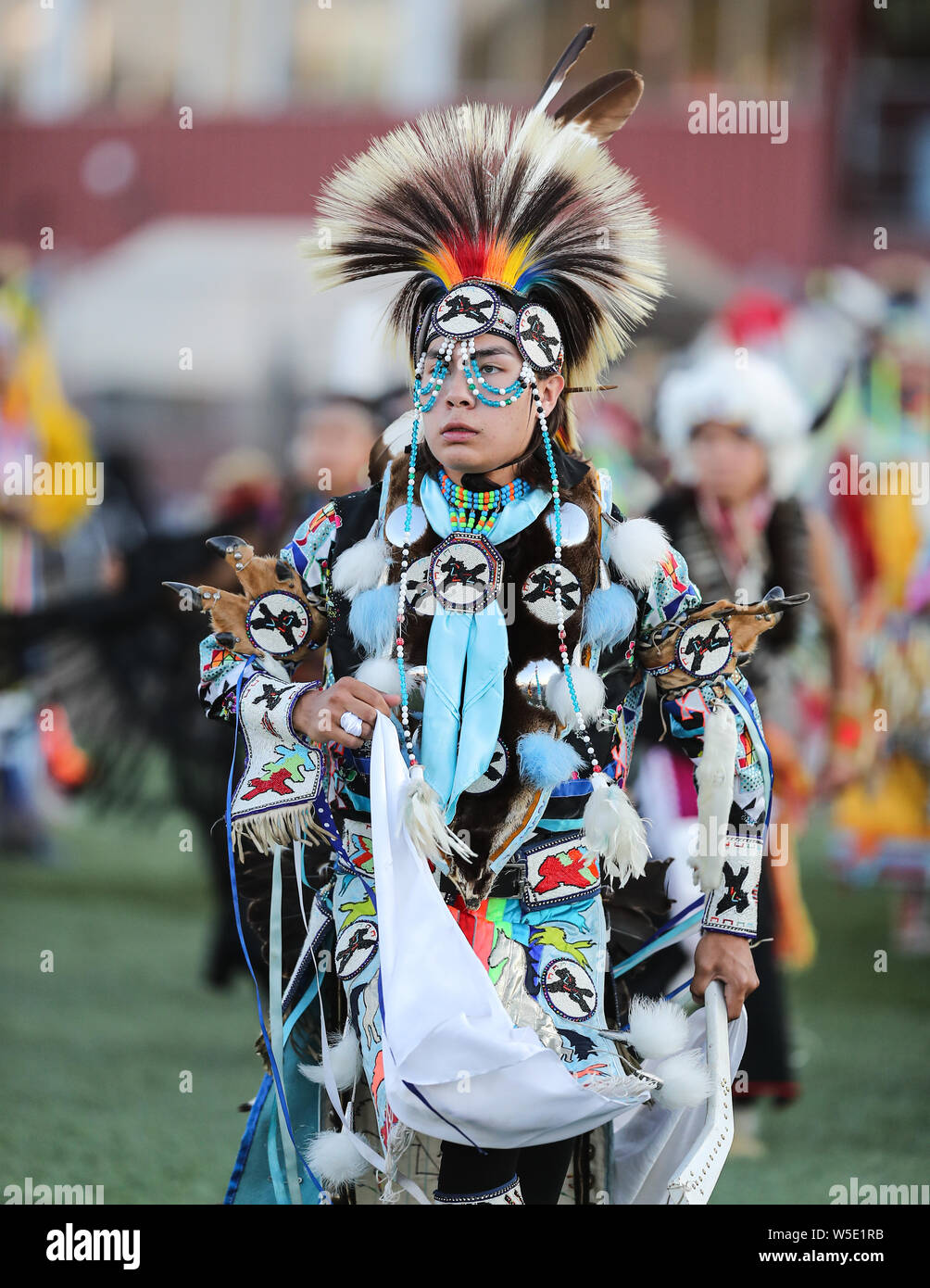 Dancers perform during the Grand Entry of the Julyamsh Pow Wow in Coeur