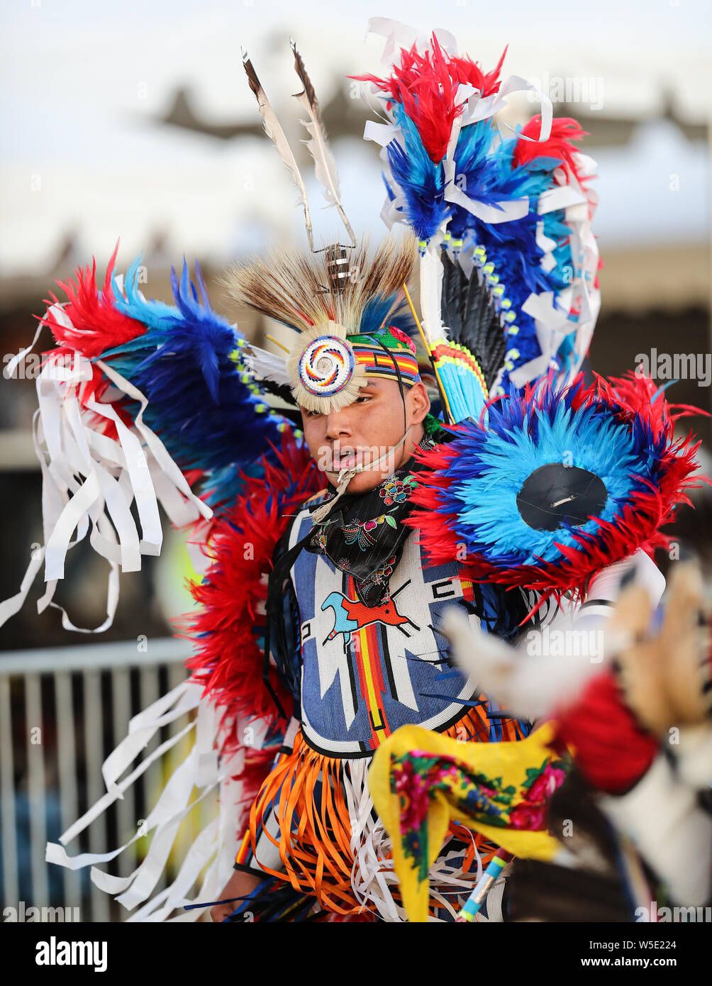 Dancers perform during the Grand Entry of the Julyamsh Pow Wow in Coeur