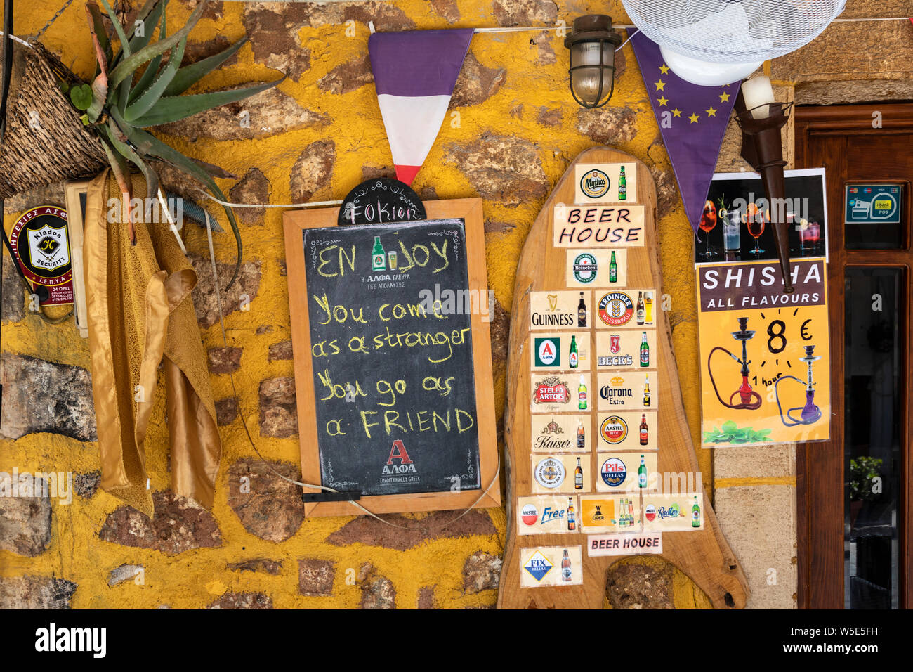 Wall of a bar / restaurant in Old Hersonissos village, Crete, Greece