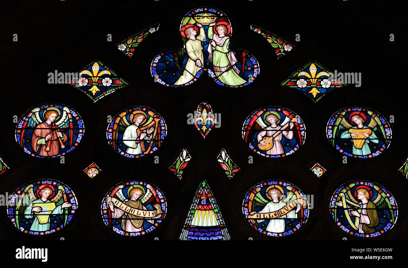 Angel musicians, stained glass window, by Frederick Preedy, 19th century, Old Hunstanton, Norfolk, England Stock Photo