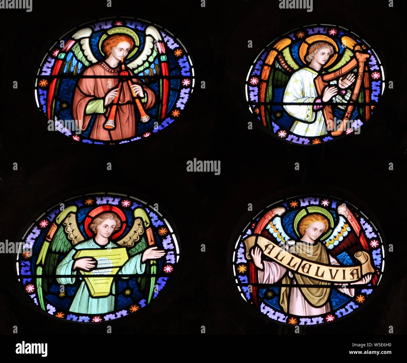 Angel musicians, stained glass window, by Frederick Preedy, 19th century, Old Hunstanton, Norfolk, England Stock Photo