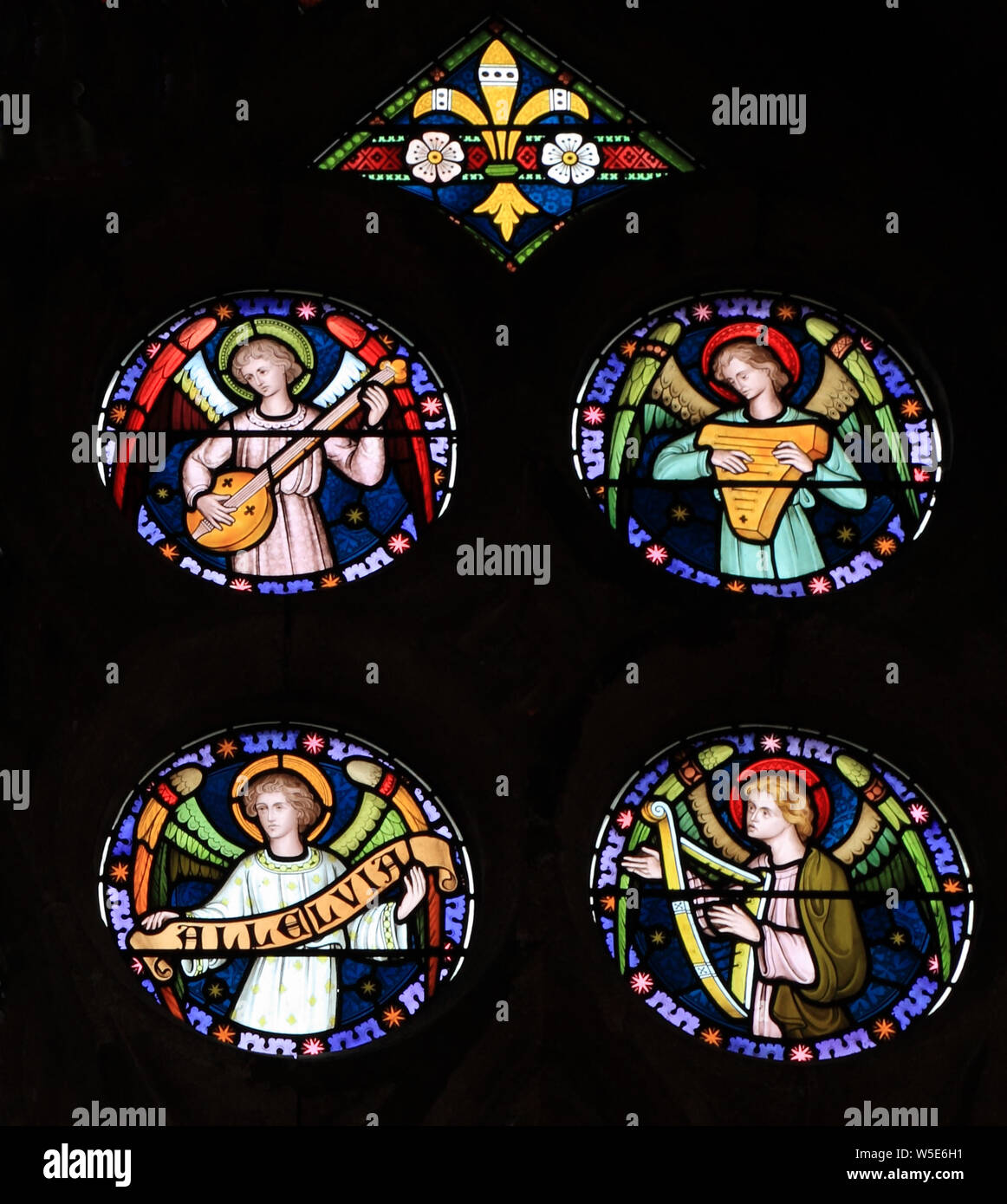 Angel musicians, stained glass window, by Frederick Preedy, 19th century, Old Hunstanton, Norfolk, England Stock Photo