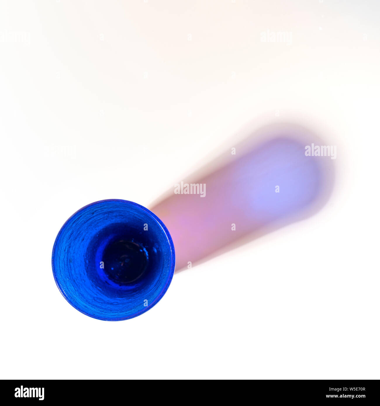 Some blue glasses on a white surface Stock Photo