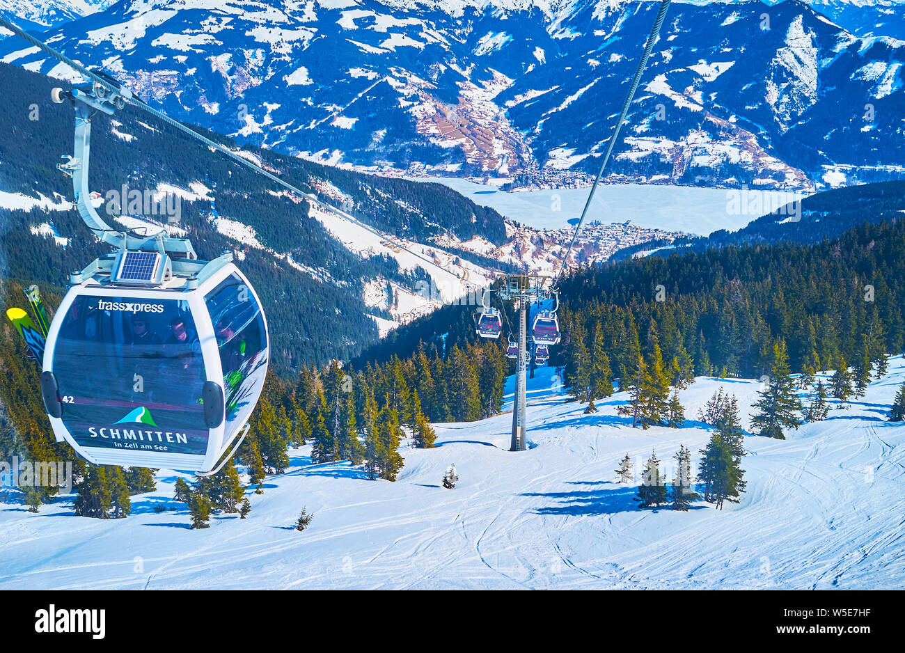 ZELL AM SEE, AUSTRIA - FEBRUARY 28, 2019: Enjoy the Schmitten Trassxpress ride from the top of Schmittenhohe mount to the valle of Zell am See resort Stock Photo
