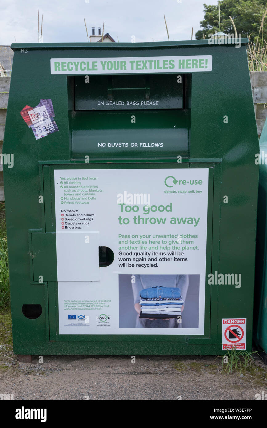 Green clothes and textiles recycling bin, Portmahomack, Highland, Scotland, UK, GB Stock Photo
