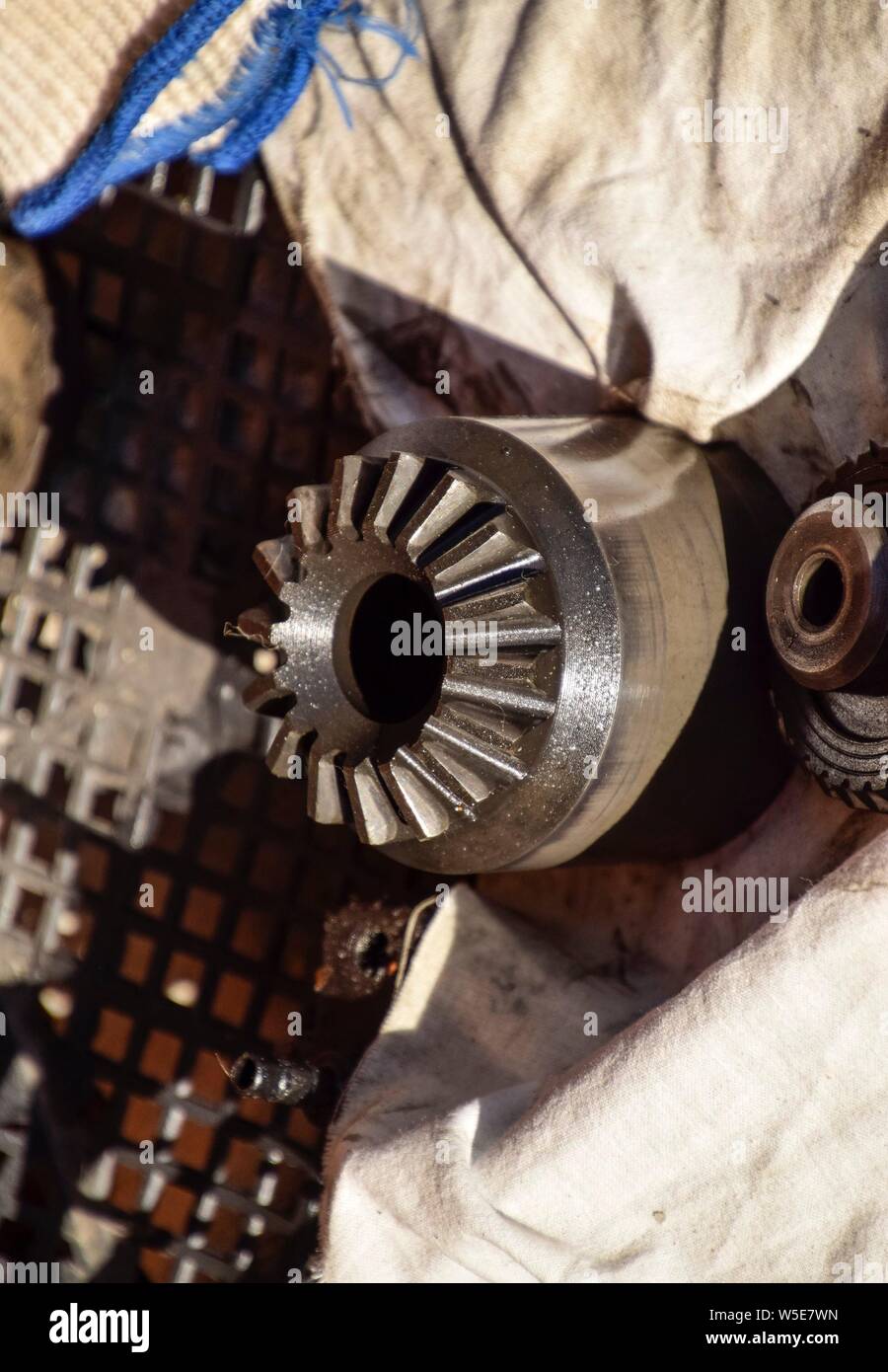 Different cog wheels dismantled from the drive line of a car Stock Photo