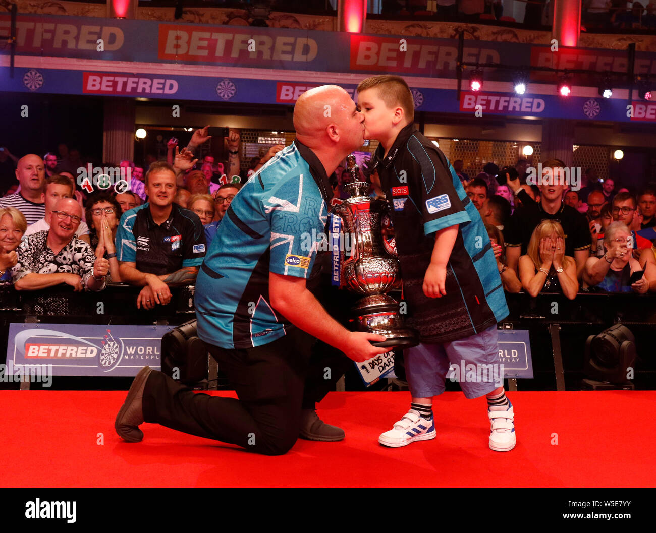 Empress Ballroom Winter Gardens Blackpool. 28th July, 2019. 2019 Betfred World  Matchplay Darts; Final; Rob Cross (ENG) and his son with the World Matchplay  trophy after his victory over Michael Smith (ENG)