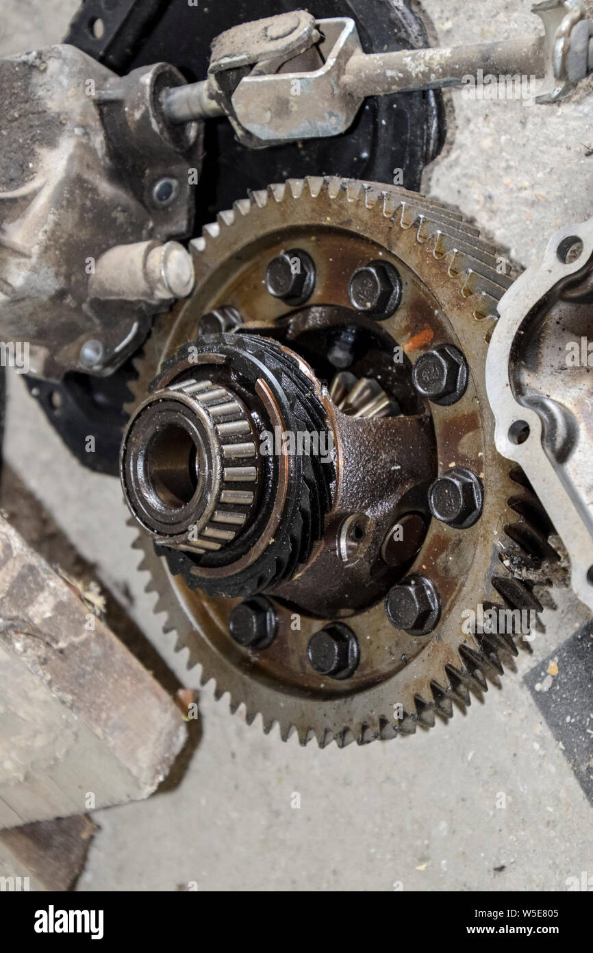 Dismantled box car transmissions. The gears on the shaft of a