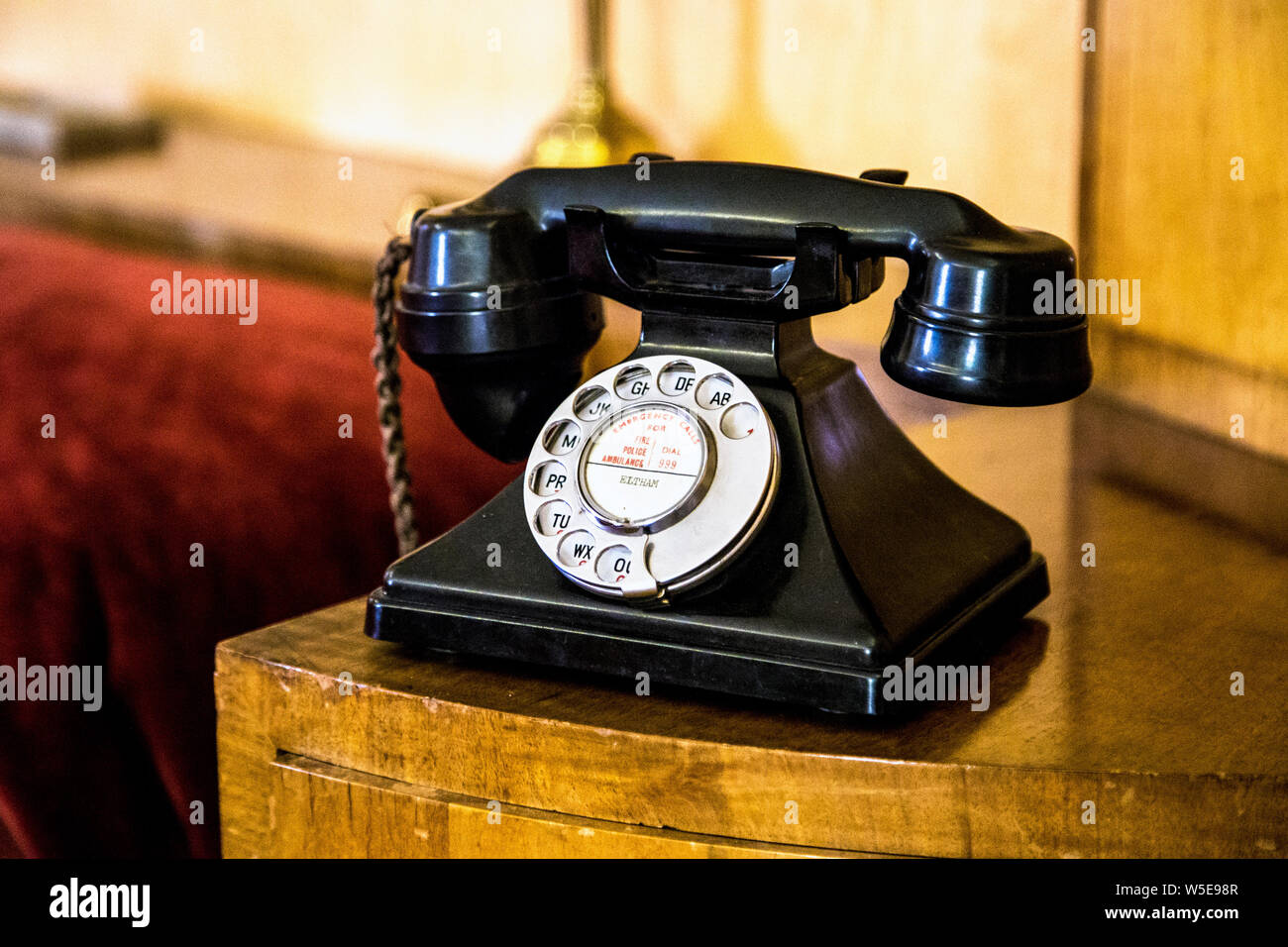 Old-fashioned rotary dial telephone with letters from the 1920s at Eltham Palace, Eltham, UK Stock Photo