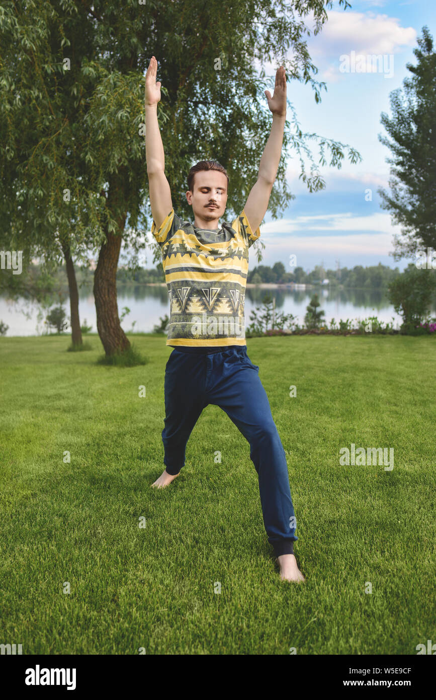Athletic young man doing yoga hi-res stock photography and images - Alamy