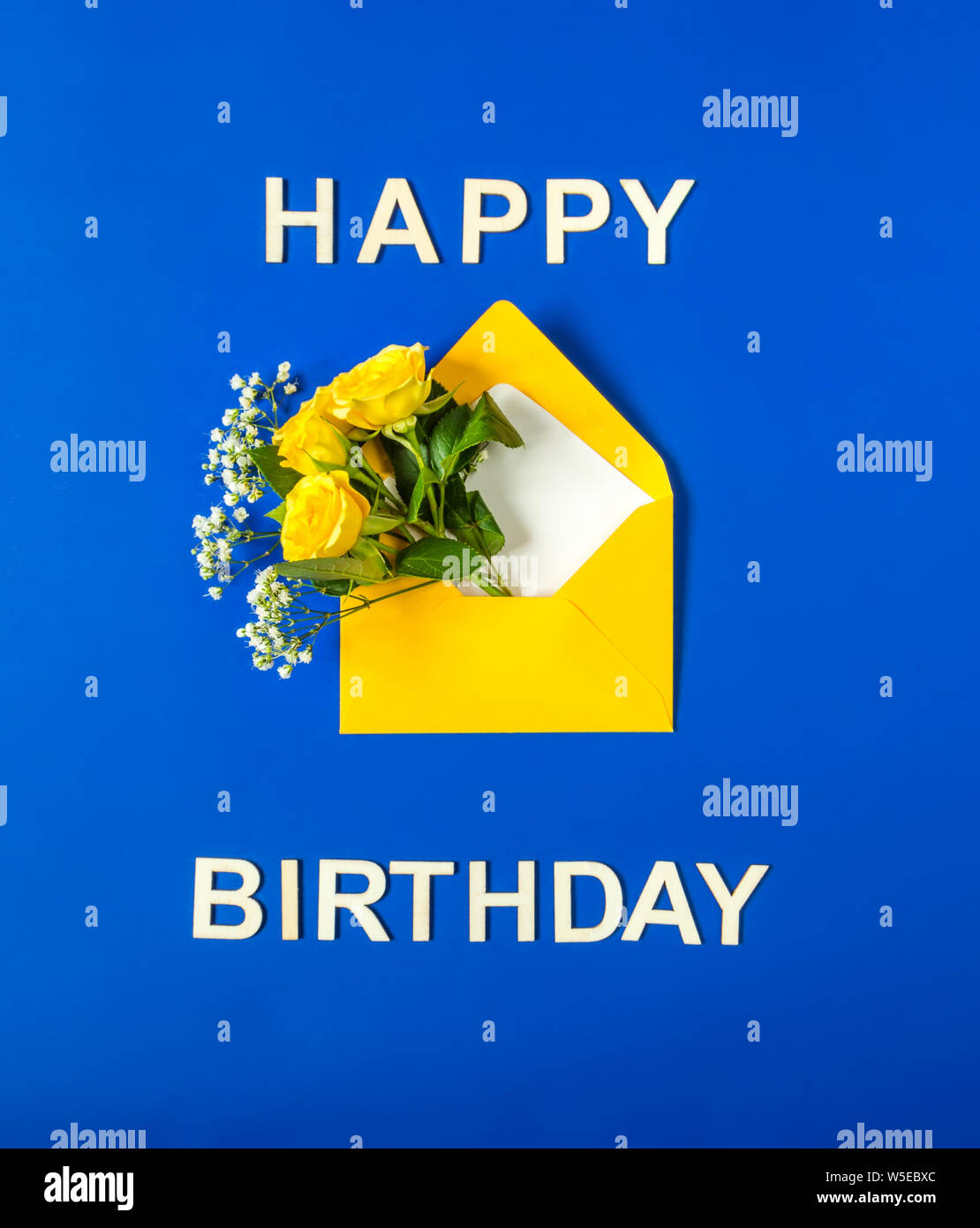 Yellow Roses And White Gypsophila In Envelope Close Up On Blue Background Text Happy Birthday Wooden Letters Top View Flat Lay Template For Birth Stock Photo Alamy