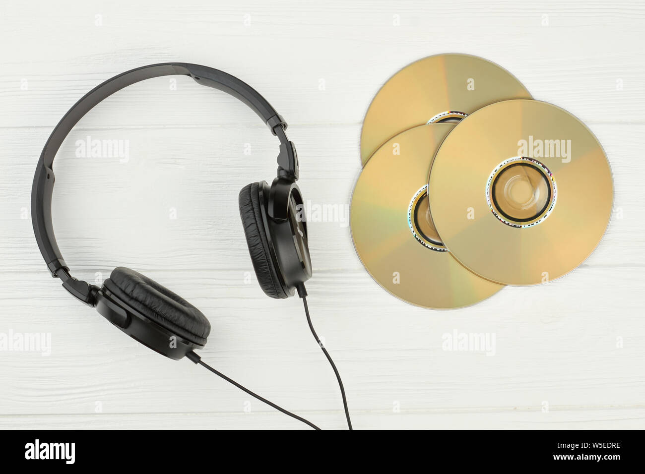 Black headphones and compact discs. Stock Photo
