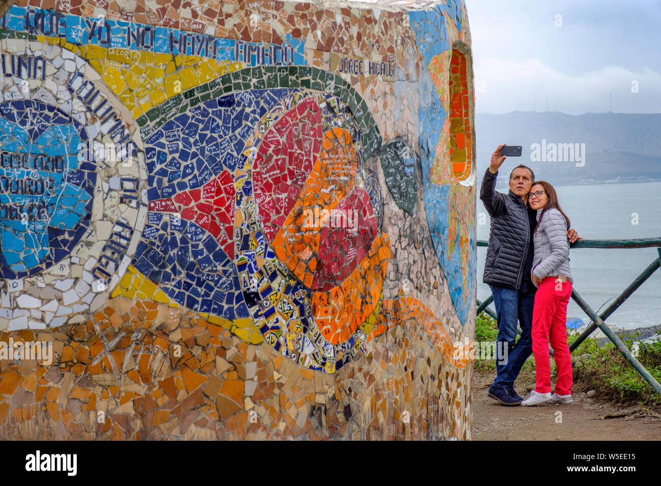 Couple taking a selfie at Parque del Amor (Love Park), city park in the District of Miraflores, Lima, Peru Stock Photo