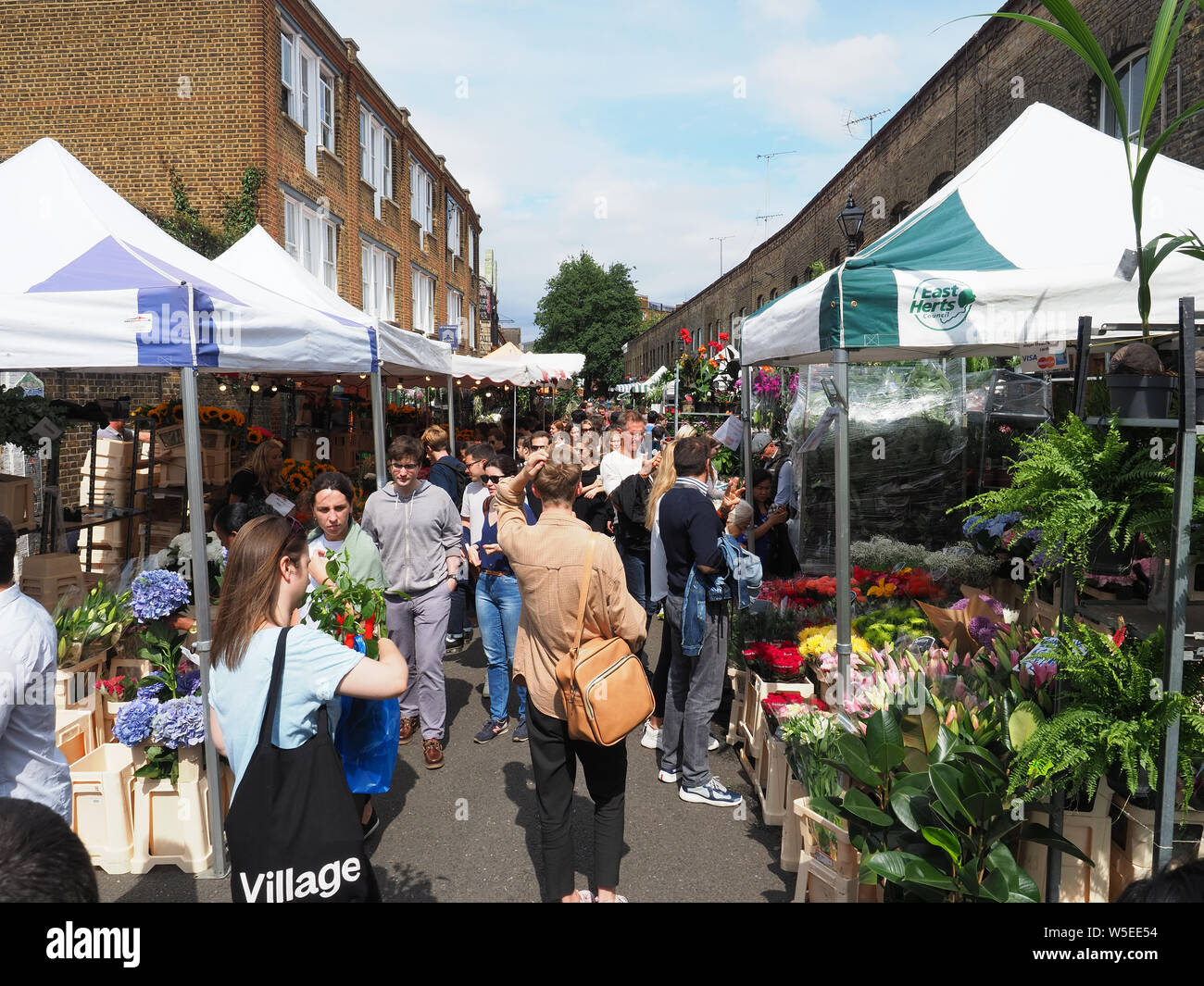 View looking along the popular Columbia Road Flower Market in Bethnal Green in London Stock Photo