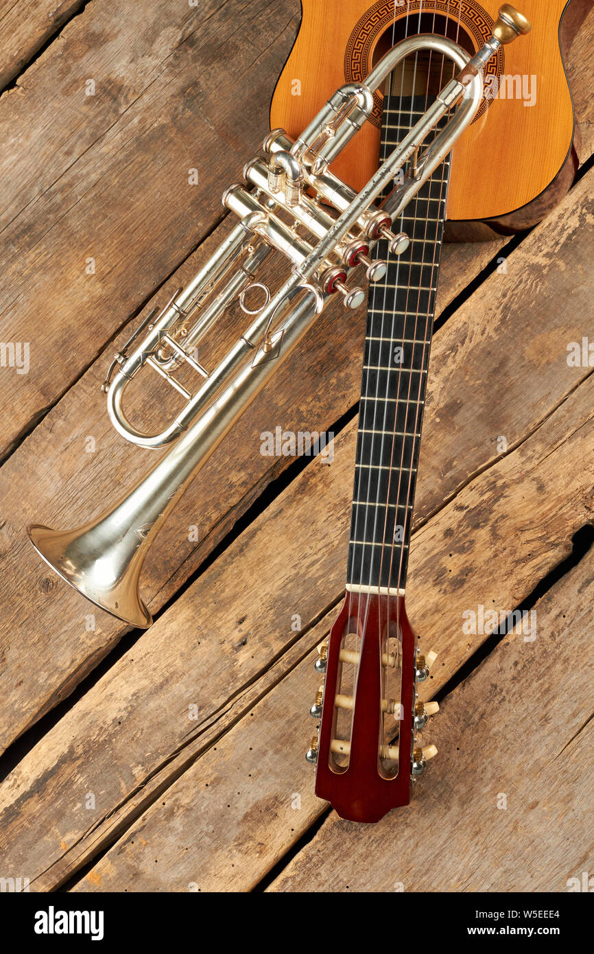 Trumpet And Guitar On Rustic Floor Acoustic Guitar And Old