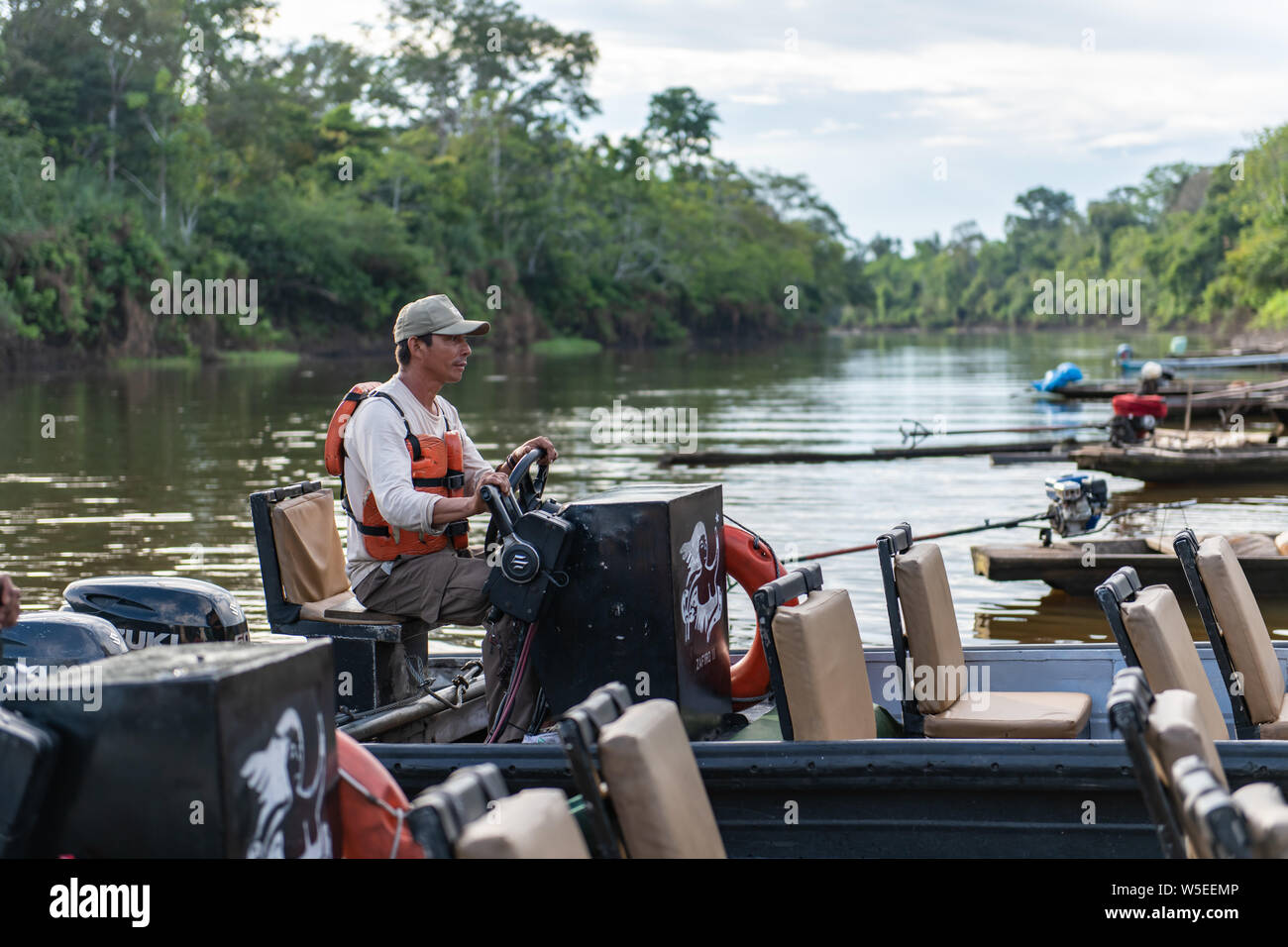 Skiffs from the Zafiro take International Expeditions passengers on daily wildlife safaris on expeditionary river cruises in the Peruvian Amazon Stock Photo