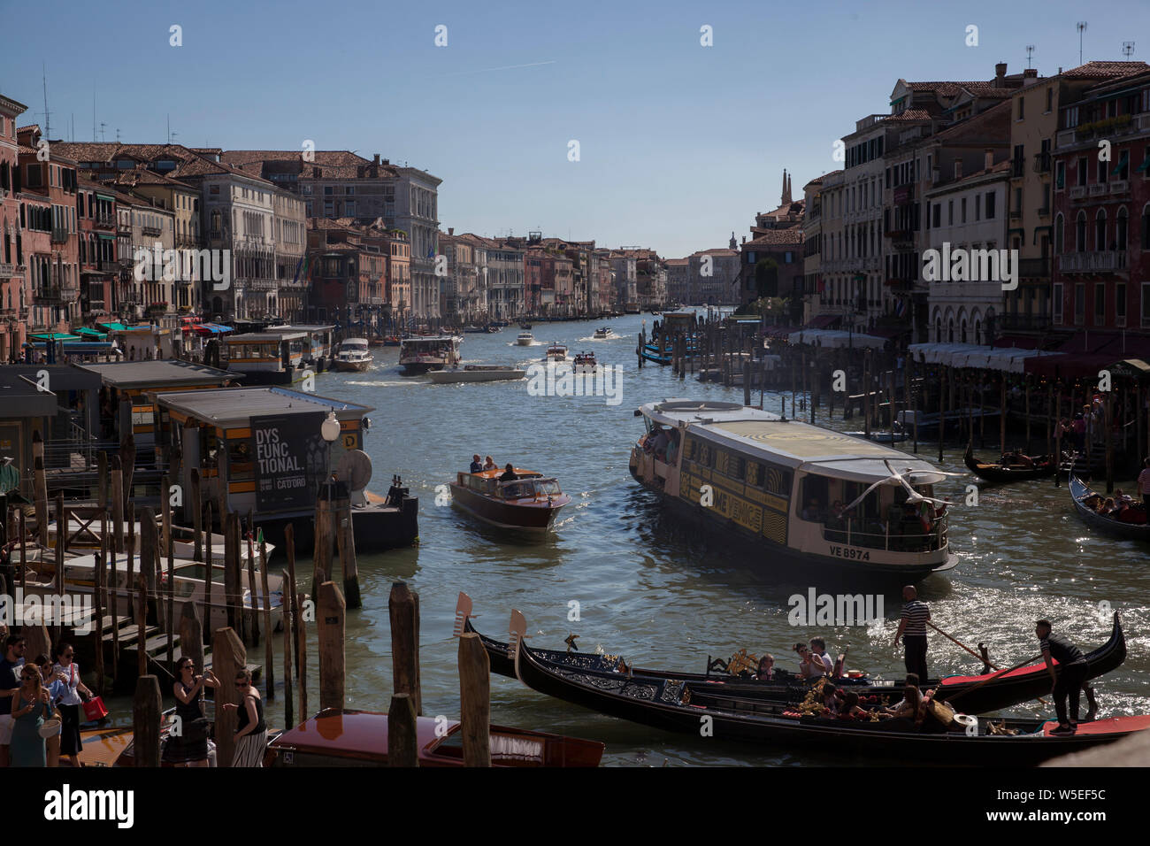 Busy boat traffic and crowded tourism In beautiful ancient city of Venice in Italy. Stock Photo