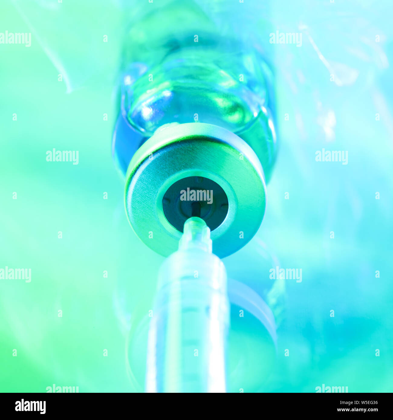 Drug vial with syringe background Stock Photo