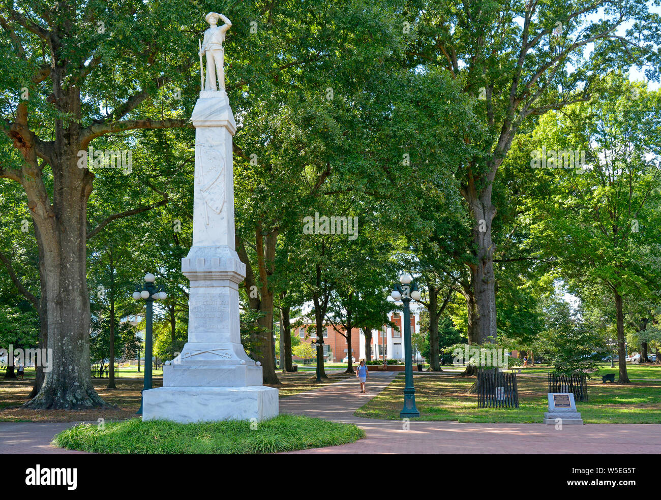 A marble Confederate solider statue atop a Civil War Memorial monument
