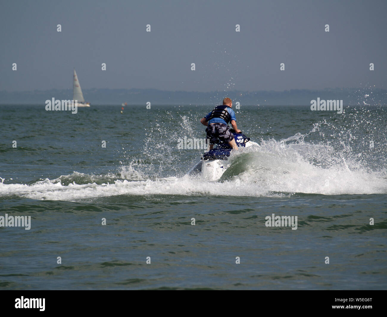 Man riding jet ski at Calshot Activities Centre, Hampshire, England UK