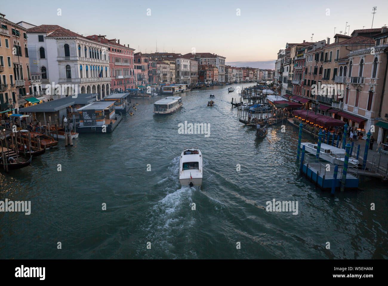 Busy boat traffic and crowded tourism In beautiful ancient city of Venice in Italy. Stock Photo